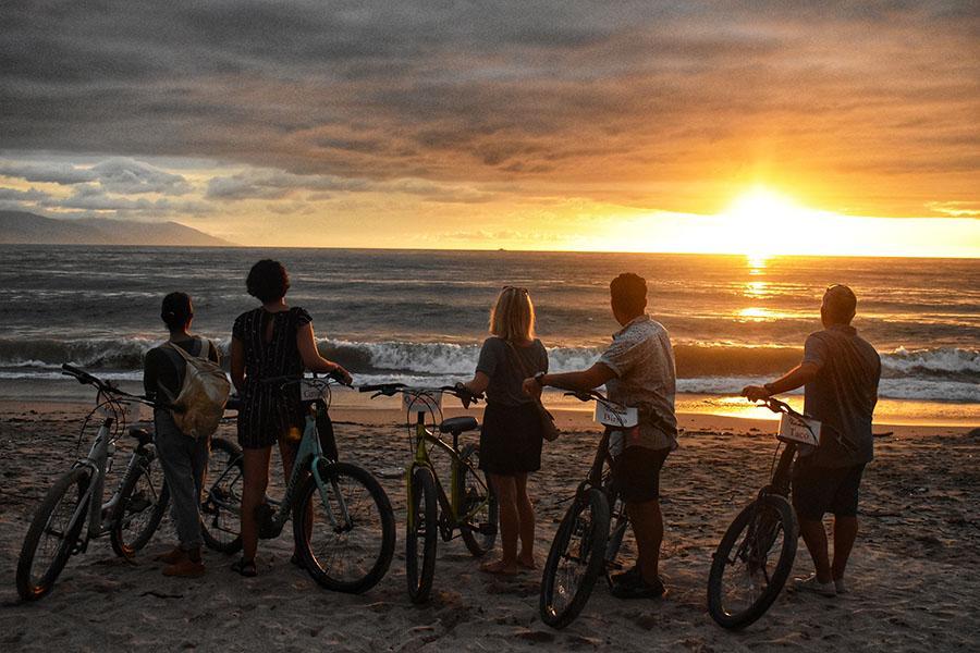 Enjoy Vallarta's famous sunset on the beach with new friends!